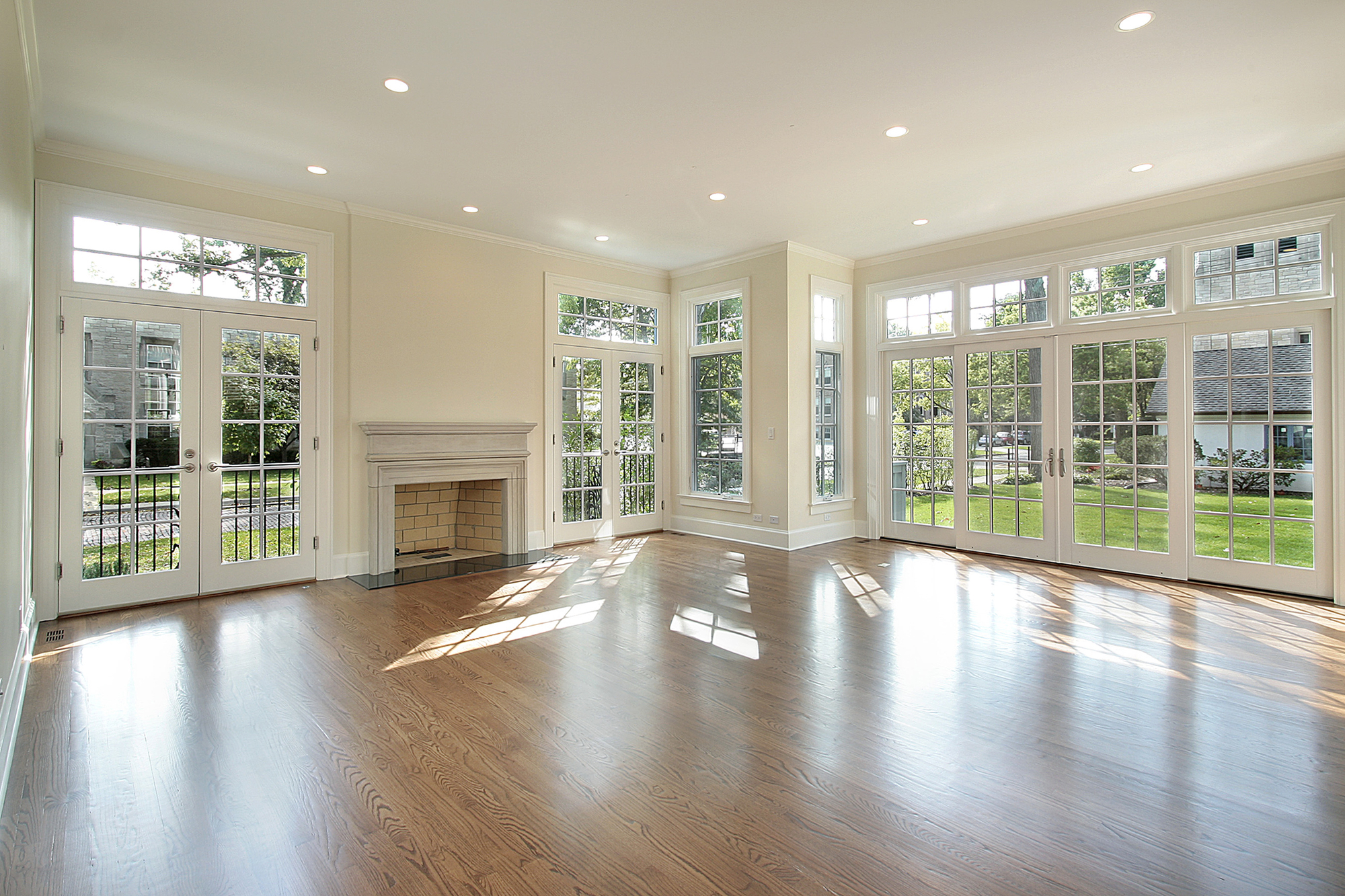 Finished basement room with columns and seating area