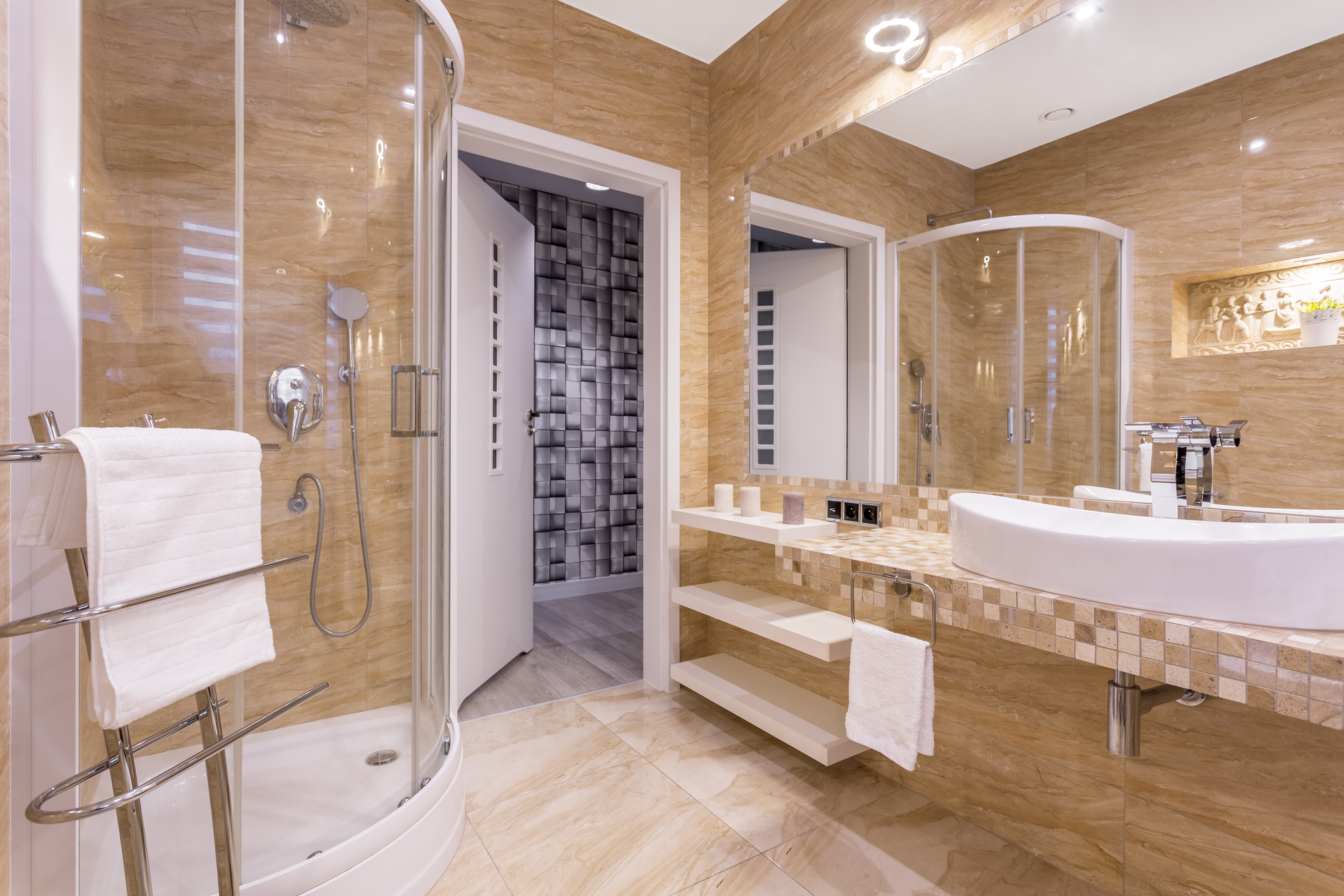 Bathroom shower with glass door and tile work